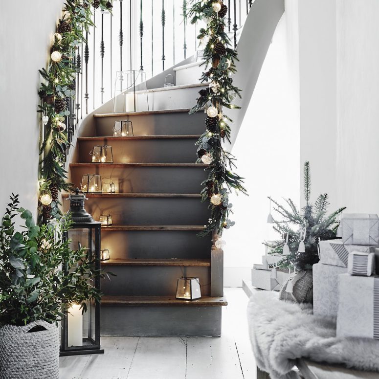 DIY Christmas home decor from natural materials. Hands make garland of  paper trees, twine and cones Stock Photo - Alamy