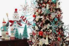 a retro Christmas tree decorated with blue, red and white ornaments so densely that the tree isn’t seen at all