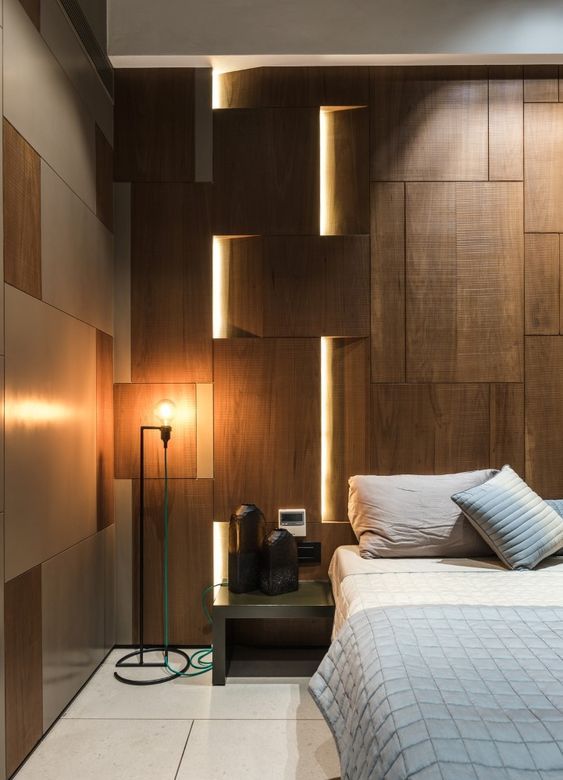 lights integrated into the wall panels make the space look modern and bold