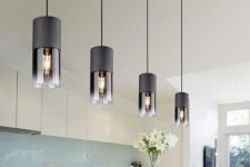 ultra-modern black pendant lamps with smoked glass will give your space an edgy feel and will make it wow
