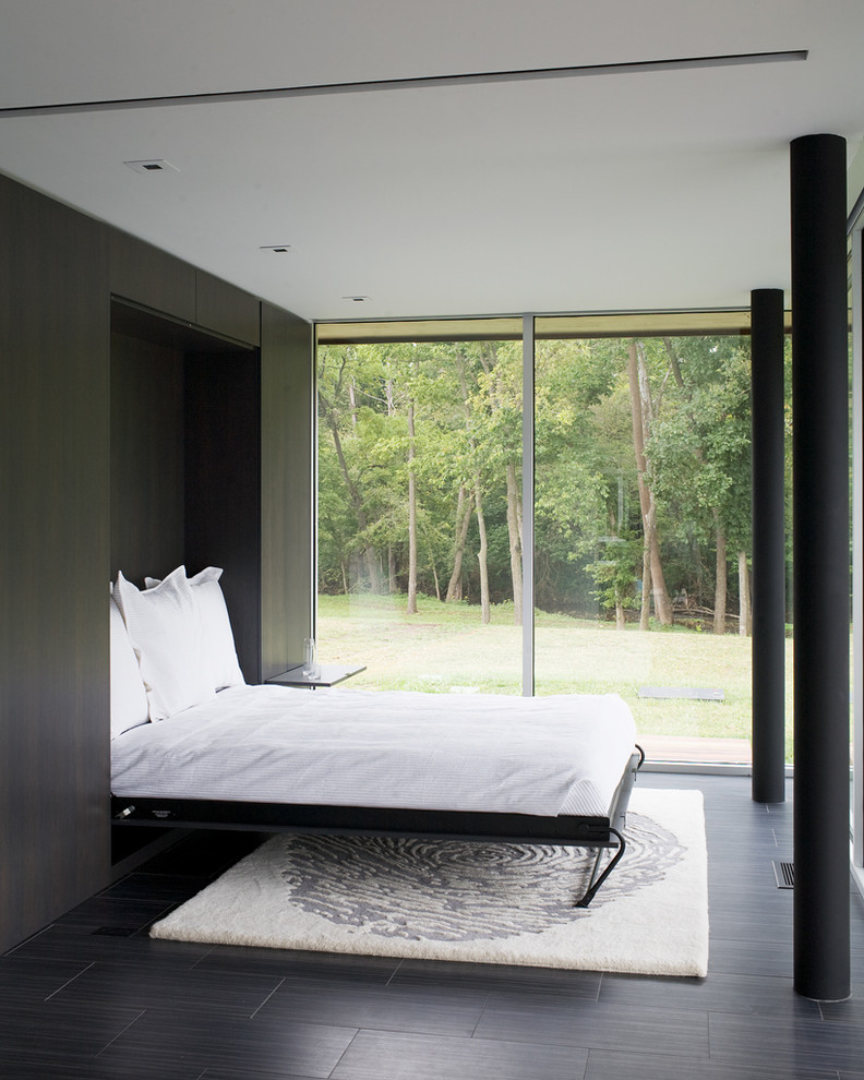 A Murphy bed folds up into the wall when not in use, opening up the floor space for another purpose.