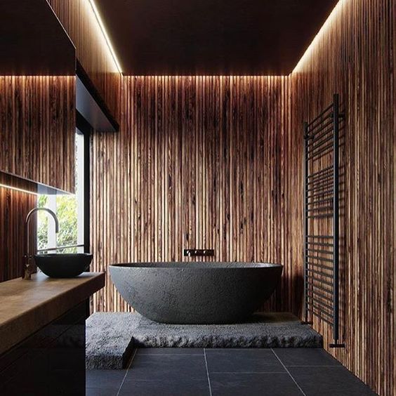 a wooden bathroom design with a moody look