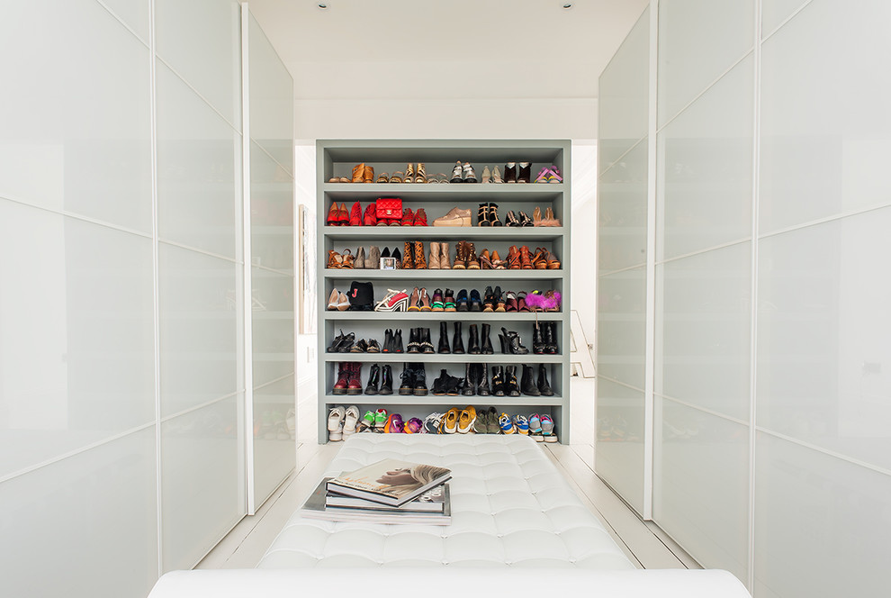 In order to make your walk-in space looks minimalist, you could conceal the wardrobe contents behind sliding doors. Leaving something on open shelves would become a focal point of such closet.