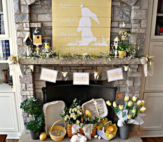 a bright and welcoming spring mantel with lots of yellow blooms, bird houses, lemons, a bunny sign and much more