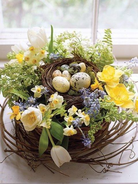 a nest flower and egg arrangement with daffodils, hyacinths and tulips and speckled eggs is ideal as an Easter centerpiece