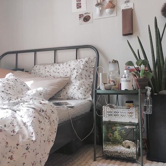a small aquarium under the nightstannd is a lovely and cool touch of nature for your bedroom