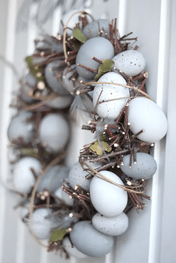 a unique rustic Easter wreath of twigs, speckled eggs and leaves is a cool idea for a rustic or organic outdoor space