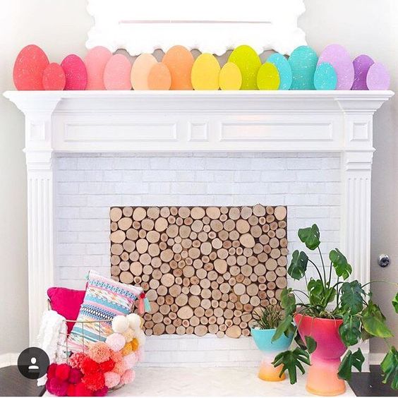 a very simple and cute Easter mantel done with rainbow colored cardboard eggs to add color
