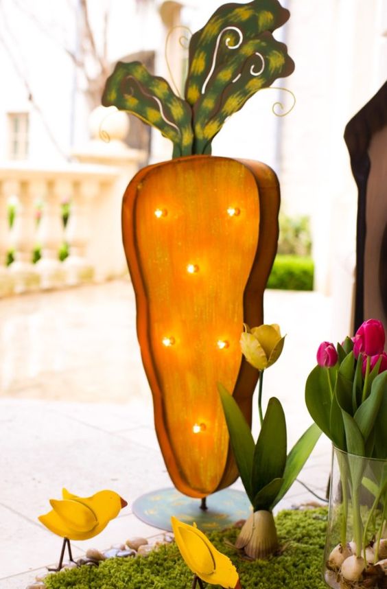 a bright carrot marquee and tulips are amazing for Easter porch decor