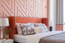 a cool modern feminine bedroom with apink geometric wall, a terracotta bed, white nightstands, color block curtains and printed bedding