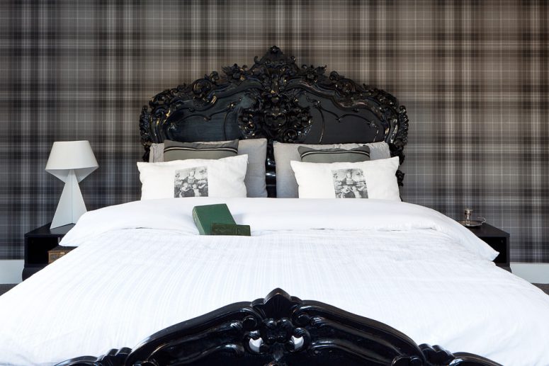 a high-gloss black lacquered bed and plaid wallpaper might look quite masculine