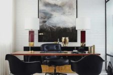 a stylish home office in neutrals with a black sideboard, a sleek wooden desk and black leather chairs for an elegant touch
