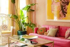a super bright feminine living room with a bol floral print rug, a hot pink sofa, a statement artwork, yellow curtains and colorful pillows