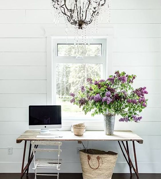 floral branches in a metal vase will bring a spring and a rustic feel to the home office or any other space