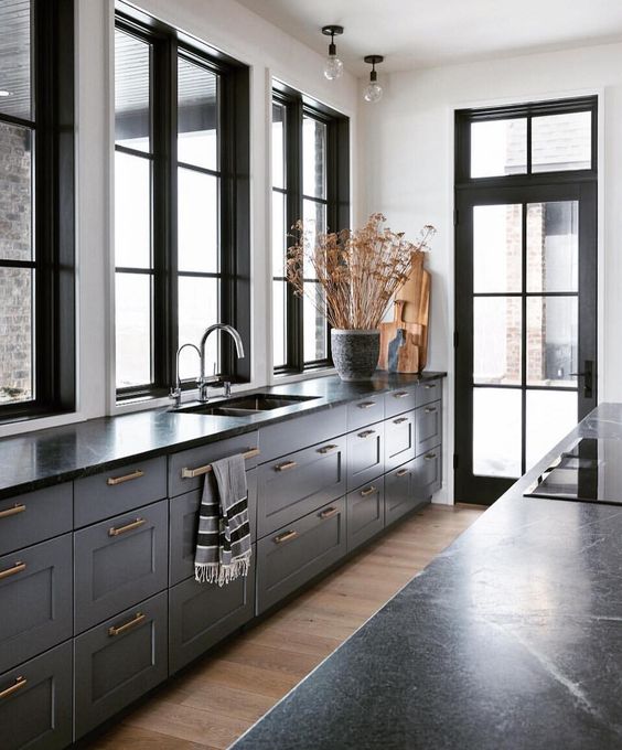 grey furniture with black countertops and gold handles for a timelessly elegant vintage look