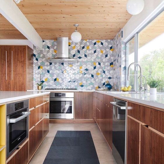 a rich-stained mid-century modern kitchen with grey, blue, white, navy and yellow tiles clad with a geometric pattern is a lovely idea
