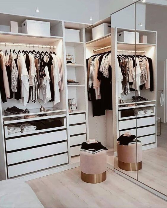 a small and glam closet with open storage units, drawers, mirrors and a pink pouf is a lovely idea for a modern home