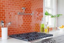 bright orange subway tiles on the backsplash will make your space bold, colorful and fun and will spruce it up with color