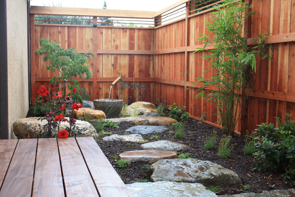 A bamboo water feature with a stone bowl would fit well even into a very small garden. Of course they would become a focal point there.