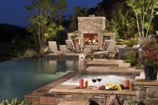a hot tub combined with a fireplace would make any outdoor place trully awesome