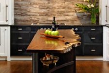 a small and narrow kitchen island in dark stained wood with a living edge countertop looks really wow