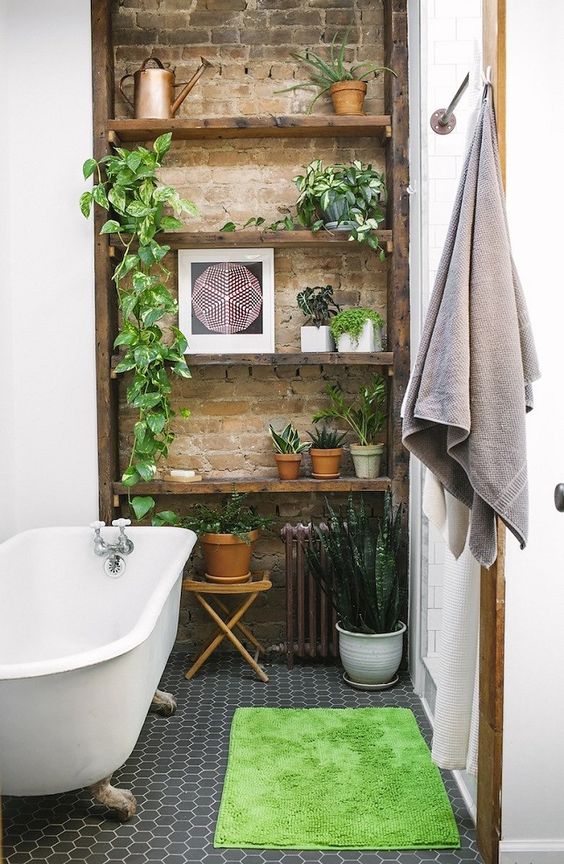 a touch of brick and potted greenery make the bathroom really eye-catching and really cool