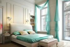 a vintage neutral bedroom with high ceilings, large windows with turquoise curtains and turquoise bedding to add more color and life to the room