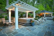 a pergola could protect an outdoor hottub