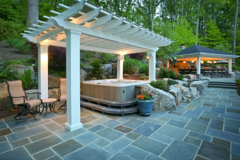 fiberglass pergola could protect your tub so you can enjoy it even during a rain  (Fine Decks Inc.)