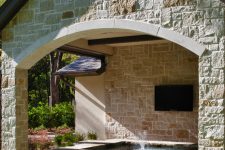 a covered hot tub with a TV