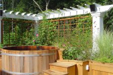 trellises on two sides of this wooden hot tub could help to create a flowering privacy screen