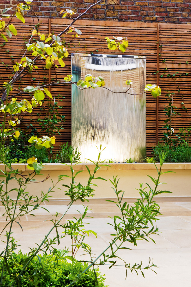 Water flowing cascade down a wall is a beautiful sight. Besides such solutions occupy very little space.