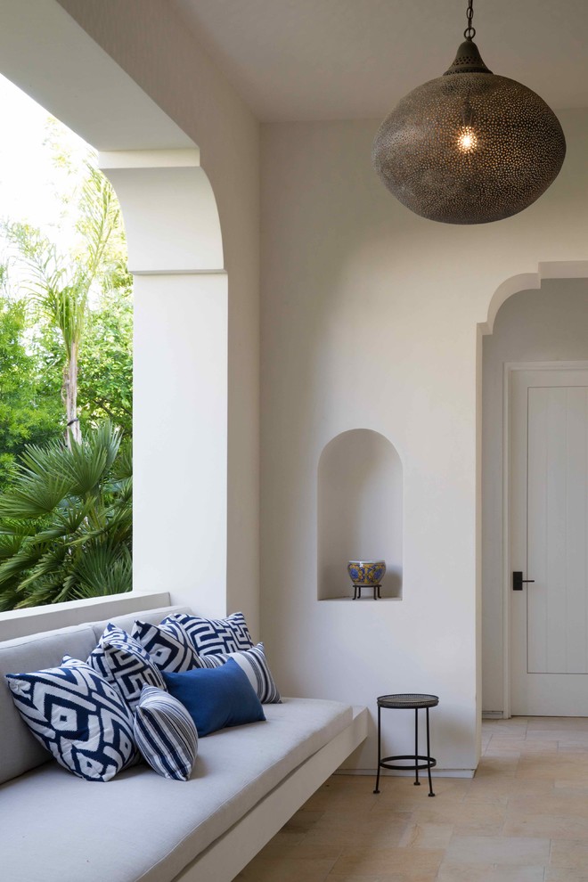 a neutral patio with colorful pillows, a niche with a vase and a large lantern has a strong Moroccan feel   (RMLA - Rob Maday Landscape Architecture, Inc.)