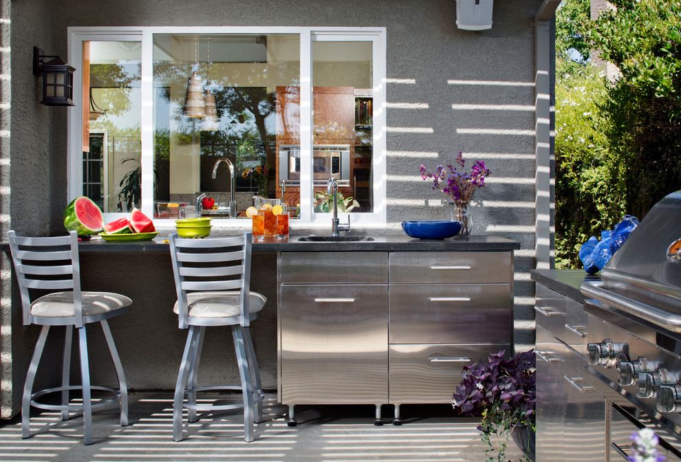 A prep area that connects two kitchens through a window is a very smart design decision.