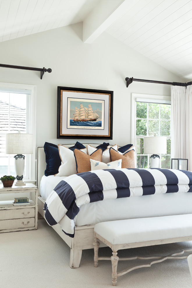 Beach style bedroom with white walls distressed furniture and simple yet cute bedding set