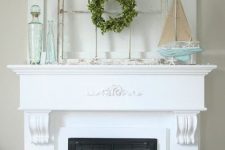 a beach mantel with a window frame, a blue boat with starfish, aqua bottles and starfish looks relaxed