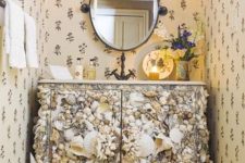 a chic powder room vanity clad with seashells is a lovely idea for a modern beach space is a gorgeous idea