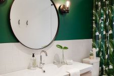 a modern tropical bathroom with a green wall and white subway tiles, a tropical curtain and a floating wooden vanity