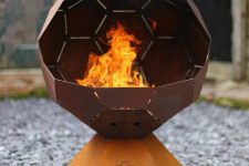 a stylish modern faceted fire bowl on a stand will catch an eye and will make your outdoors cooler and bolder
