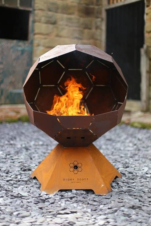 a stylish modern faceted fire bowl on a stand will catch an eye and will make your outdoors cooler and bolder