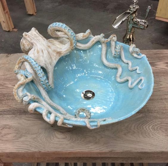 an octopus sink in blue will catch an eye in your bathroom or powder room and will make it unforgettable