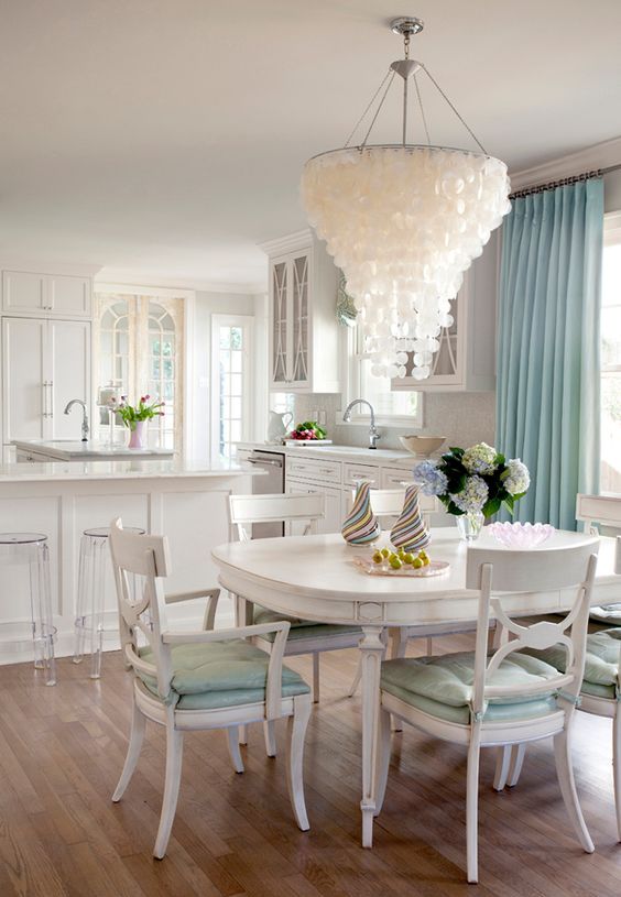 an oversized capiz shell chandelier like this one will accent any beach or coastal space at once and will make a statement