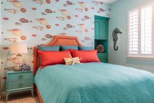 orange and turquoise color theme is perfect for a sea themed kids bedroom