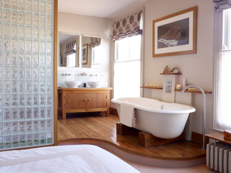 a contemporary meets rustic bathroom with much wood and glass in decor  (Mark Jordan Architecture &amp; Design)