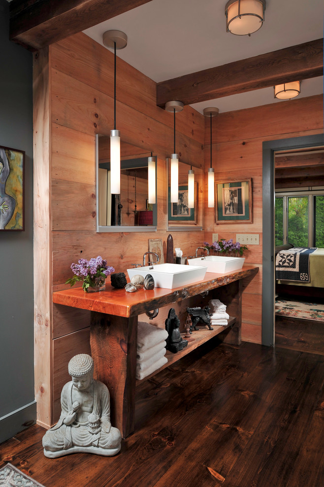 a rustic bathroom in redwood with an asian feel and a bench as a vanity