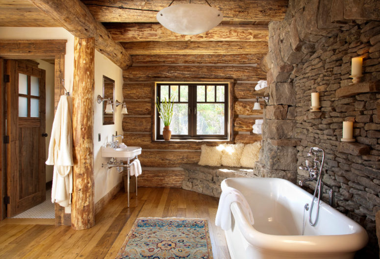 a chalet-inspired bathroom with a stone wall, wooden walls, floor and ceiling and some boho rugs  (Pearson Design Group)