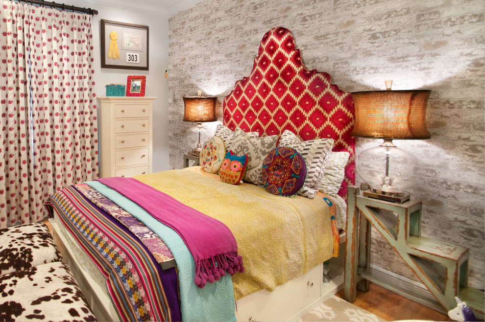 Whitewashed brick provides a subtile backdrop for this cool boho bed. 