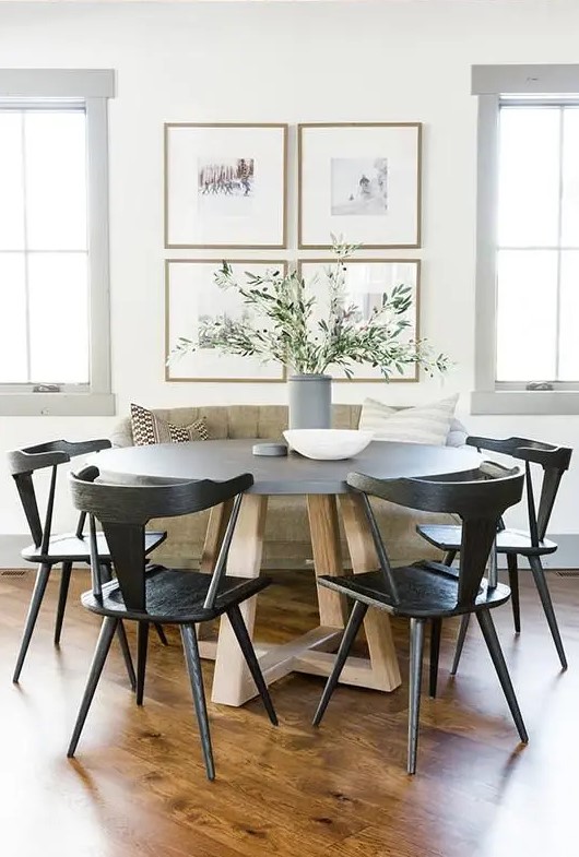 a lovely dining room with a rustic gallery wall