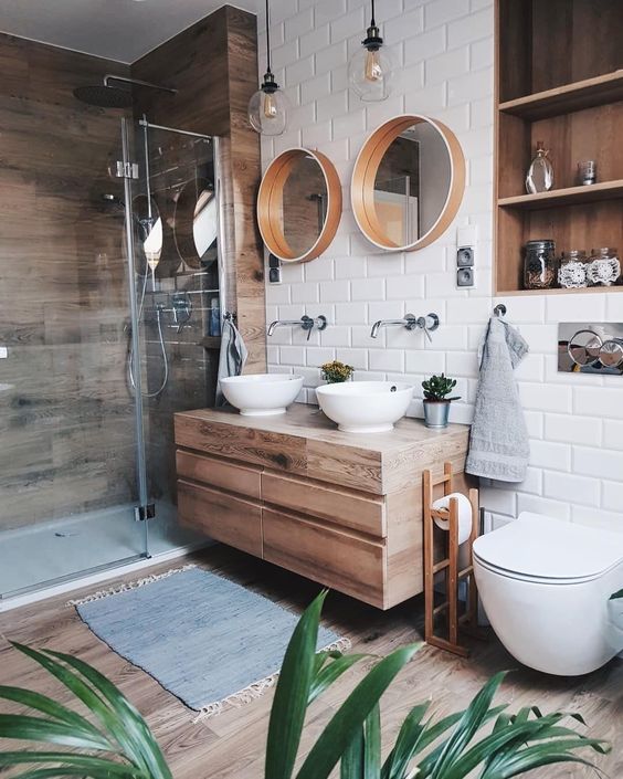 a contemporary bathroom with rustic touches, a wooden wall, floor and a vanity
