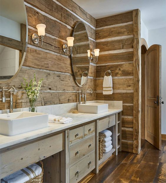 a contemporary rustic bathroom with much wood in decor - wooden planks on the wall and wooden furniture